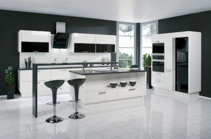 Klasyczny nowoczesny minimalizm - narożna czarno-biała kuchnia